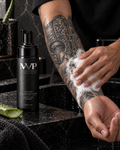 MVP Tattoo Cleansing Foam used gently on a black-and-grey Viking forearm tattoo