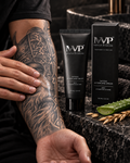 MVP Aftercare Cream applied in a thin layer to a black-and-grey Viking forearm tattoo